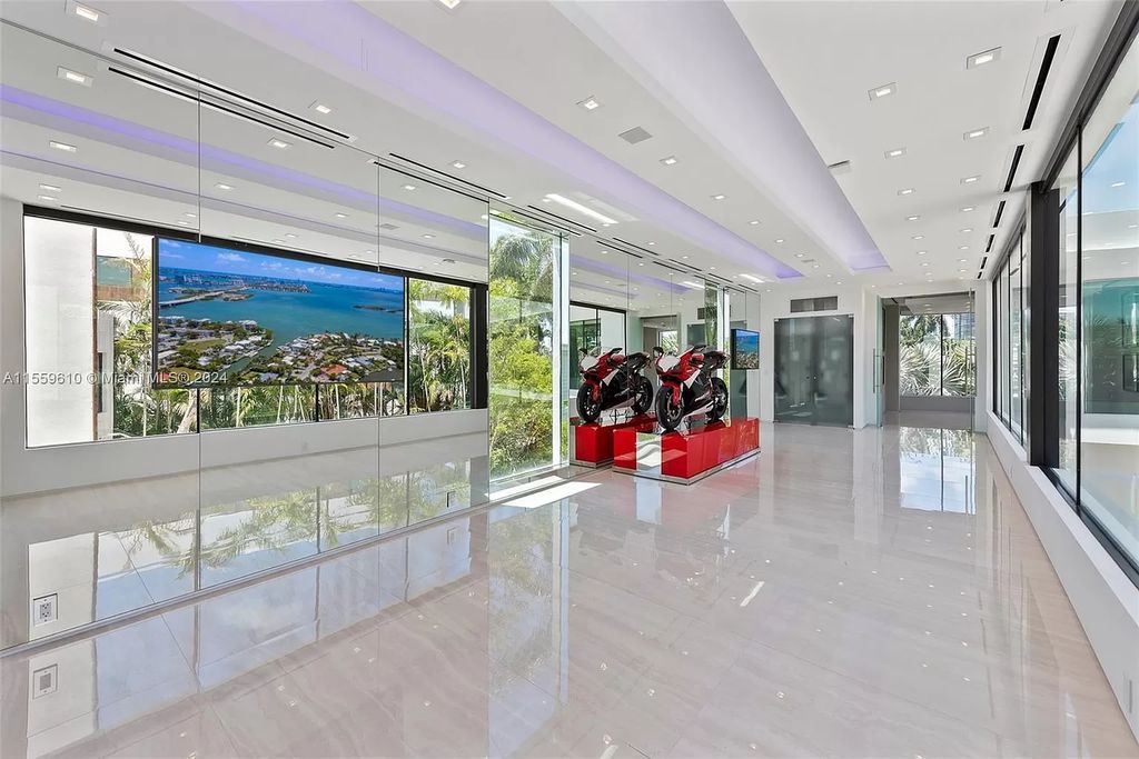 Welcome to 1133 Belle Meade Island Dr, a breathtaking Bay/Canal Contemporary Residence in the heart of Miami. This New Construction marvel boasts 100+ ft on deep water, showcasing Travertine exterior walls and ultra-luxury finishes throughout its 12,200 SF under A/C.