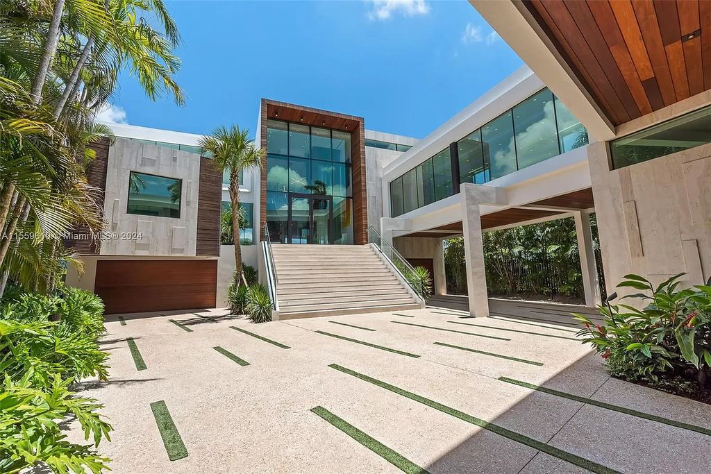 Welcome to 1133 Belle Meade Island Dr, a breathtaking Bay/Canal Contemporary Residence in the heart of Miami. This New Construction marvel boasts 100+ ft on deep water, showcasing Travertine exterior walls and ultra-luxury finishes throughout its 12,200 SF under A/C.