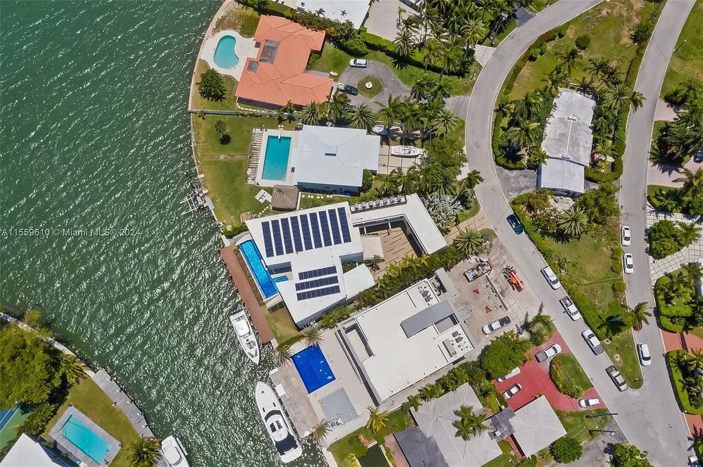 Welcome to 1133 Belle Meade Island Dr, a breathtaking Bay/Canal Contemporary Residence in the heart of Miami. This New Construction marvel boasts 100+ ft on deep water, showcasing Travertine exterior walls and ultra-luxury finishes throughout its 12,200 SF under A/C.