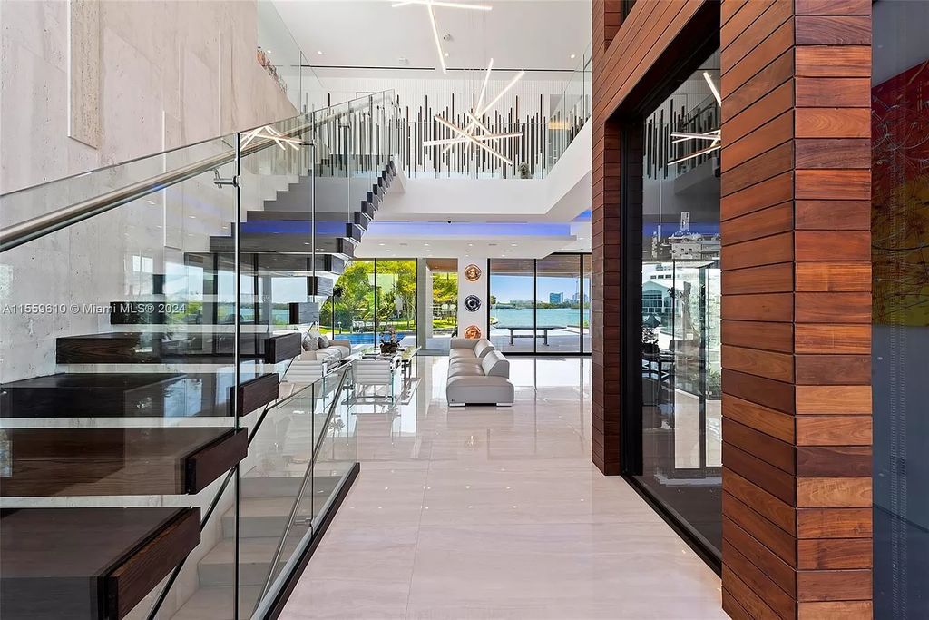 Welcome to 1133 Belle Meade Island Dr, a breathtaking Bay/Canal Contemporary Residence in the heart of Miami. This New Construction marvel boasts 100+ ft on deep water, showcasing Travertine exterior walls and ultra-luxury finishes throughout its 12,200 SF under A/C.