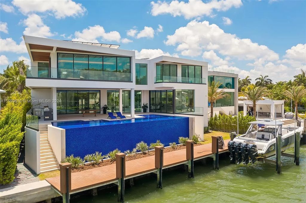 Welcome to 1133 Belle Meade Island Dr, a breathtaking Bay/Canal Contemporary Residence in the heart of Miami. This New Construction marvel boasts 100+ ft on deep water, showcasing Travertine exterior walls and ultra-luxury finishes throughout its 12,200 SF under A/C.
