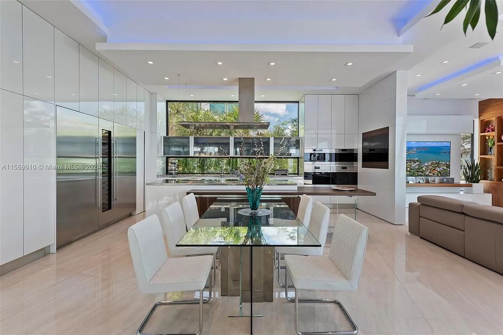 Welcome to 1133 Belle Meade Island Dr, a breathtaking Bay/Canal Contemporary Residence in the heart of Miami. This New Construction marvel boasts 100+ ft on deep water, showcasing Travertine exterior walls and ultra-luxury finishes throughout its 12,200 SF under A/C.
