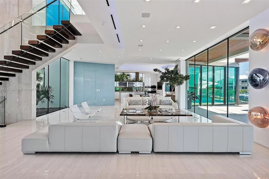 Welcome to 1133 Belle Meade Island Dr, a breathtaking Bay/Canal Contemporary Residence in the heart of Miami. This New Construction marvel boasts 100+ ft on deep water, showcasing Travertine exterior walls and ultra-luxury finishes throughout its 12,200 SF under A/C.