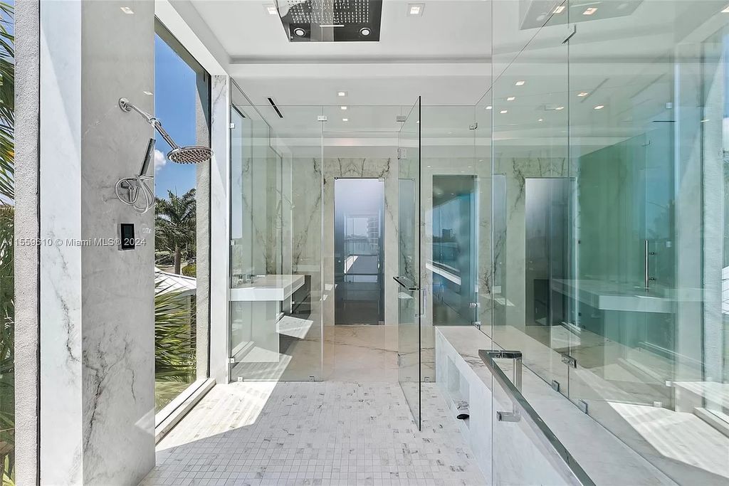 Welcome to 1133 Belle Meade Island Dr, a breathtaking Bay/Canal Contemporary Residence in the heart of Miami. This New Construction marvel boasts 100+ ft on deep water, showcasing Travertine exterior walls and ultra-luxury finishes throughout its 12,200 SF under A/C.