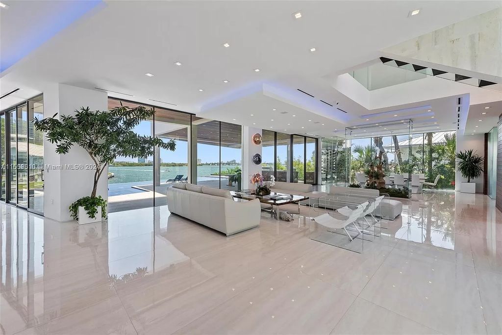 Welcome to 1133 Belle Meade Island Dr, a breathtaking Bay/Canal Contemporary Residence in the heart of Miami. This New Construction marvel boasts 100+ ft on deep water, showcasing Travertine exterior walls and ultra-luxury finishes throughout its 12,200 SF under A/C.
