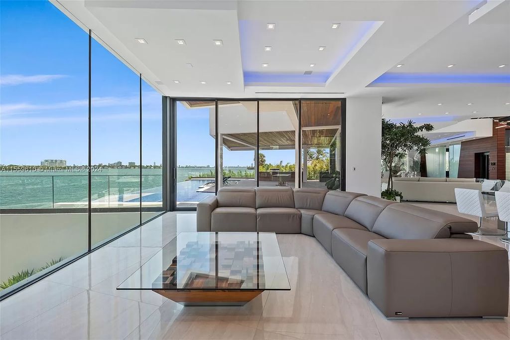 Welcome to 1133 Belle Meade Island Dr, a breathtaking Bay/Canal Contemporary Residence in the heart of Miami. This New Construction marvel boasts 100+ ft on deep water, showcasing Travertine exterior walls and ultra-luxury finishes throughout its 12,200 SF under A/C.