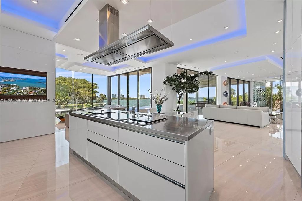 Welcome to 1133 Belle Meade Island Dr, a breathtaking Bay/Canal Contemporary Residence in the heart of Miami. This New Construction marvel boasts 100+ ft on deep water, showcasing Travertine exterior walls and ultra-luxury finishes throughout its 12,200 SF under A/C.