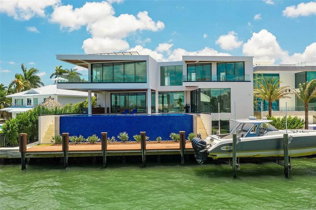 Welcome to 1133 Belle Meade Island Dr, a breathtaking Bay/Canal Contemporary Residence in the heart of Miami. This New Construction marvel boasts 100+ ft on deep water, showcasing Travertine exterior walls and ultra-luxury finishes throughout its 12,200 SF under A/C.