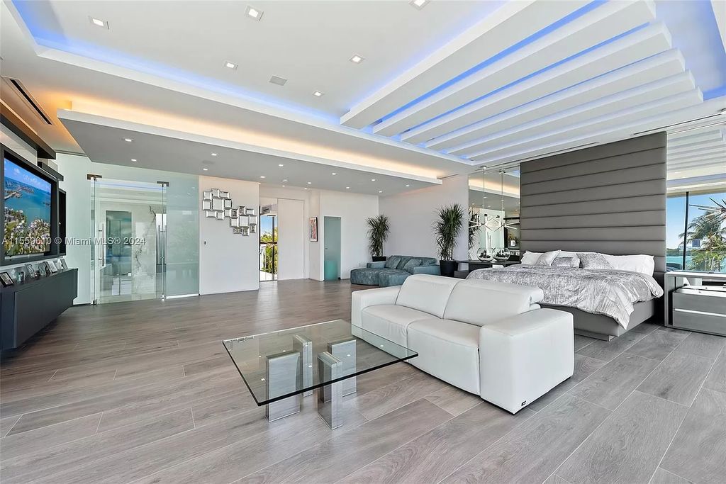 Welcome to 1133 Belle Meade Island Dr, a breathtaking Bay/Canal Contemporary Residence in the heart of Miami. This New Construction marvel boasts 100+ ft on deep water, showcasing Travertine exterior walls and ultra-luxury finishes throughout its 12,200 SF under A/C.
