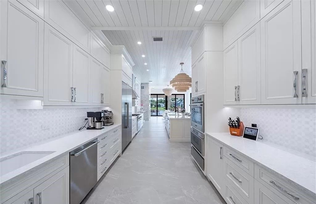 Welcome to 6536 Highcroft Drive in Quail West, Naples, Florida - a home where luxury meets comfort in every detail.