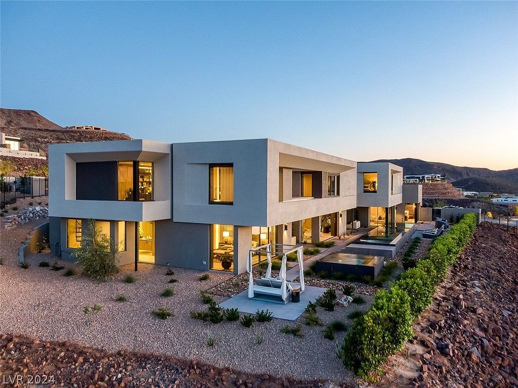 709 Dragon Peak Drive Home in Henderson, Nevada. Discover the thrill of living at Drift, an extraordinary residence from The Luminary Collection, fully furnished by Atelier Blue Heron Interiors and ready for immediate move-in. Nestled within the exclusive guard-gated enclave of MacDonald Highlands, Drift offers an enviable address on Dragon Peak Drive, often hailed as the Hollywood Hills of Las Vegas.