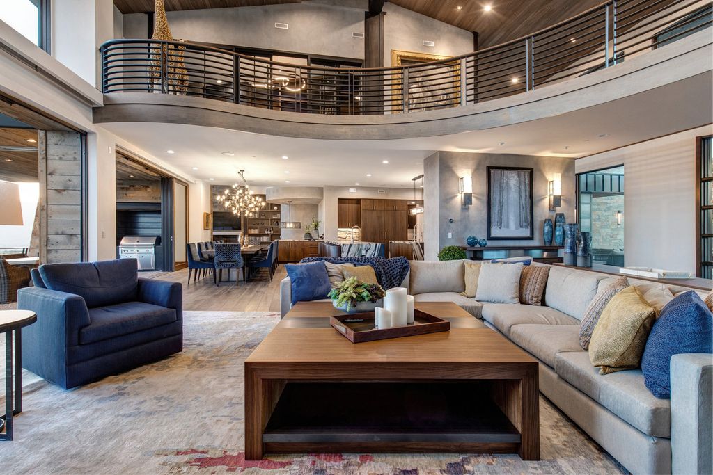 831 N Explorer Peak Drive Home in Heber, Utah. Perched atop the highest ridge within the exclusive confines of Red Ledges, this estate offers unparalleled vistas of the Mountain West. Crafted by renowned architect Michael Upwall, this residence redefines mountain modern living. 
