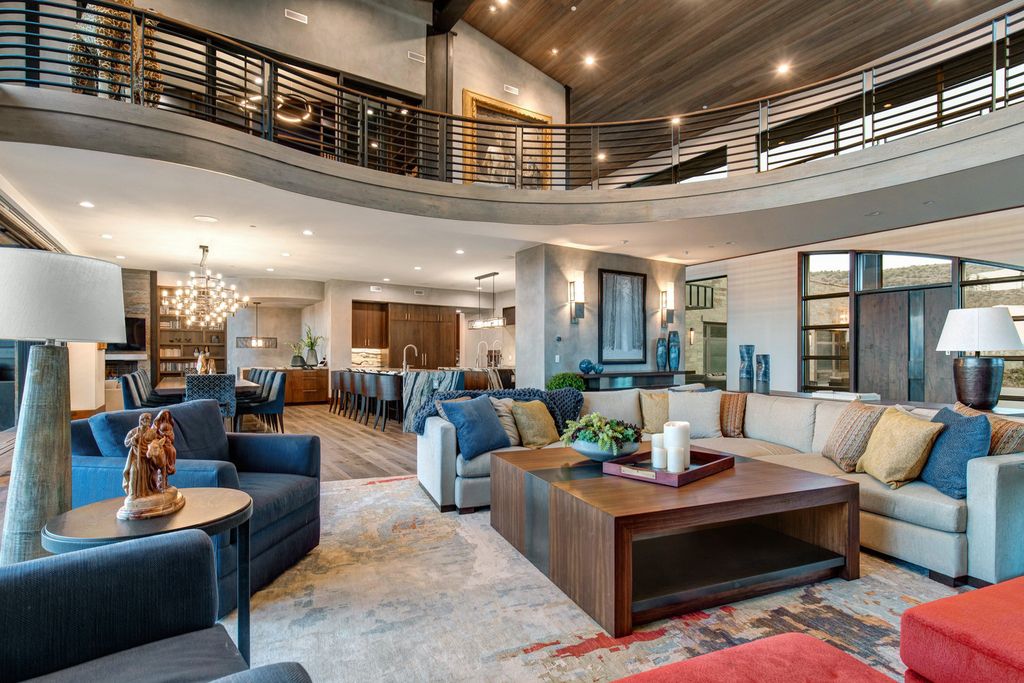 831 N Explorer Peak Drive Home in Heber, Utah. Perched atop the highest ridge within the exclusive confines of Red Ledges, this estate offers unparalleled vistas of the Mountain West. Crafted by renowned architect Michael Upwall, this residence redefines mountain modern living. 