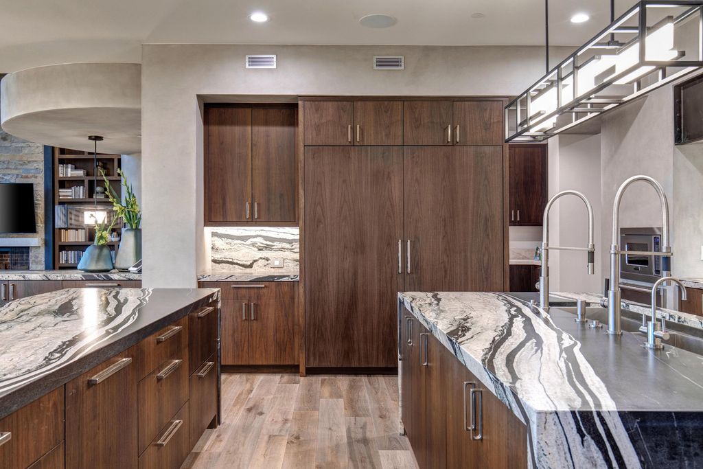 831 N Explorer Peak Drive Home in Heber, Utah. Perched atop the highest ridge within the exclusive confines of Red Ledges, this estate offers unparalleled vistas of the Mountain West. Crafted by renowned architect Michael Upwall, this residence redefines mountain modern living. 