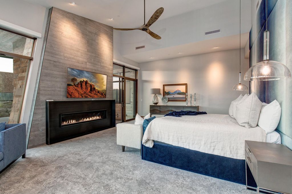 831 N Explorer Peak Drive Home in Heber, Utah. Perched atop the highest ridge within the exclusive confines of Red Ledges, this estate offers unparalleled vistas of the Mountain West. Crafted by renowned architect Michael Upwall, this residence redefines mountain modern living. 
