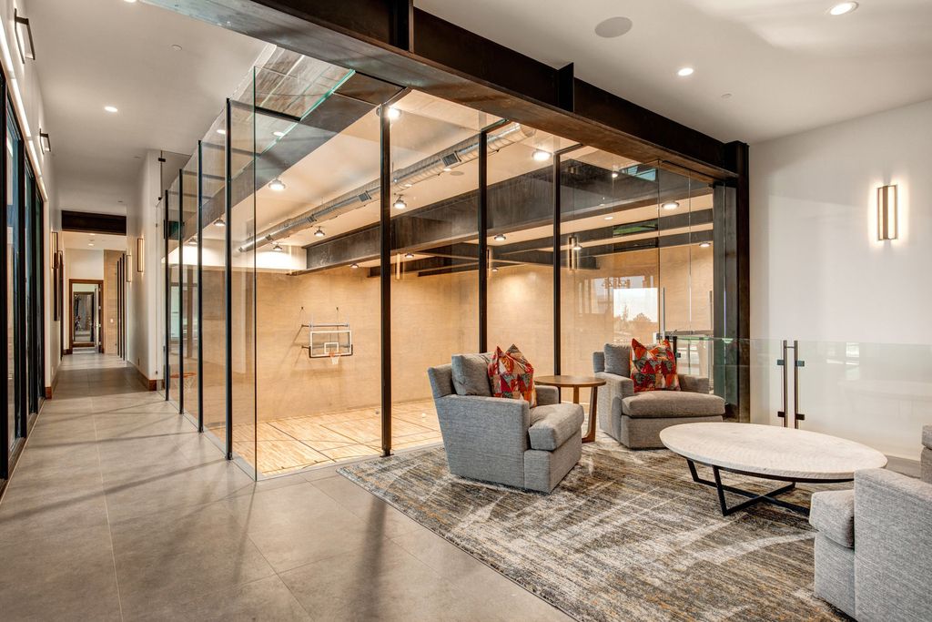 831 N Explorer Peak Drive Home in Heber, Utah. Perched atop the highest ridge within the exclusive confines of Red Ledges, this estate offers unparalleled vistas of the Mountain West. Crafted by renowned architect Michael Upwall, this residence redefines mountain modern living. 