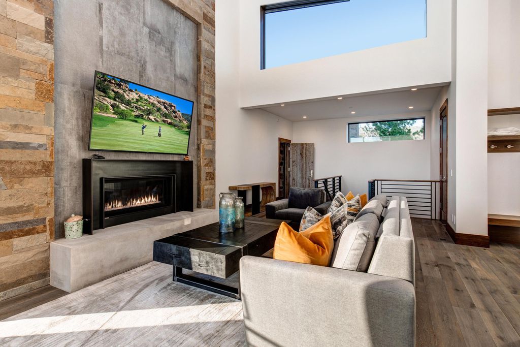 831 N Explorer Peak Drive Home in Heber, Utah. Perched atop the highest ridge within the exclusive confines of Red Ledges, this estate offers unparalleled vistas of the Mountain West. Crafted by renowned architect Michael Upwall, this residence redefines mountain modern living. 