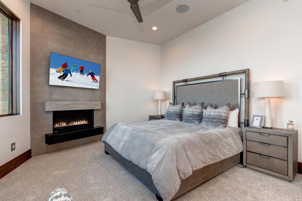 831 N Explorer Peak Drive Home in Heber, Utah. Perched atop the highest ridge within the exclusive confines of Red Ledges, this estate offers unparalleled vistas of the Mountain West. Crafted by renowned architect Michael Upwall, this residence redefines mountain modern living. 