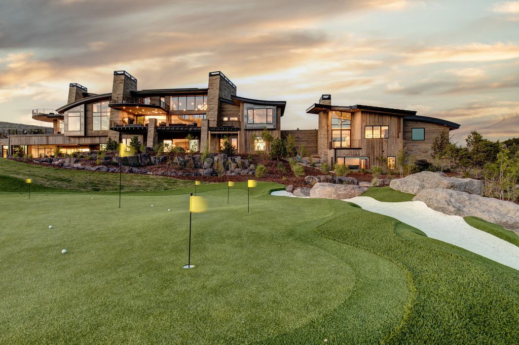 831 N Explorer Peak Drive Home in Heber, Utah. Perched atop the highest ridge within the exclusive confines of Red Ledges, this estate offers unparalleled vistas of the Mountain West. Crafted by renowned architect Michael Upwall, this residence redefines mountain modern living. 