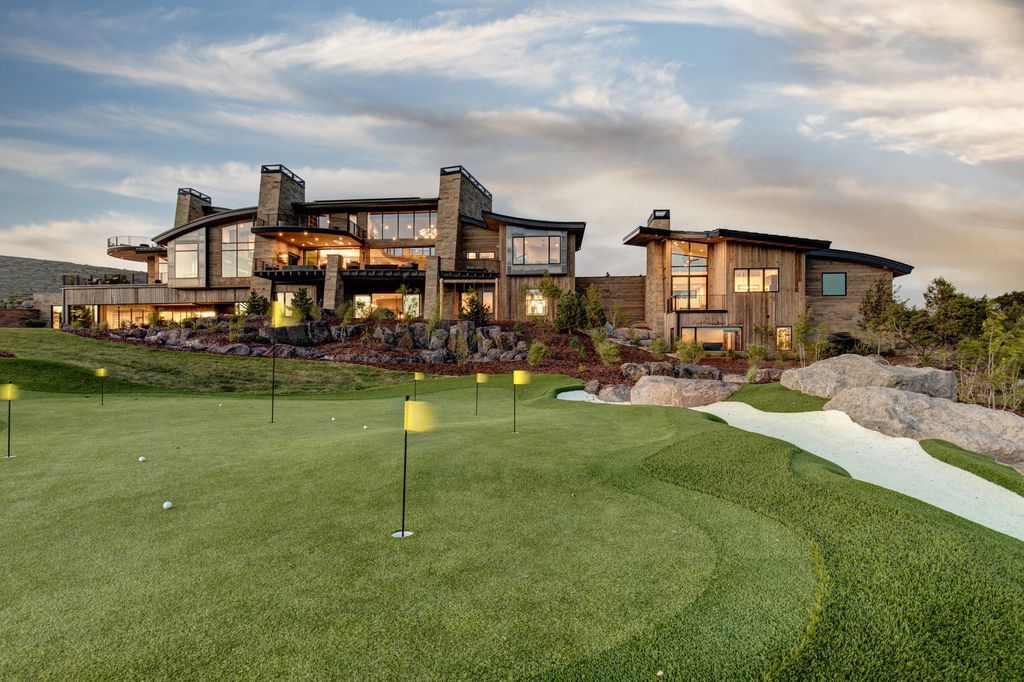 831 N Explorer Peak Drive Home in Heber, Utah. Perched atop the highest ridge within the exclusive confines of Red Ledges, this estate offers unparalleled vistas of the Mountain West. Crafted by renowned architect Michael Upwall, this residence redefines mountain modern living. 