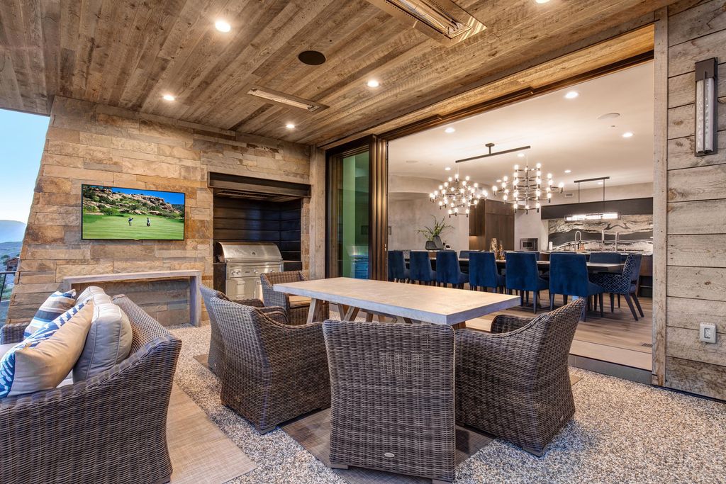 831 N Explorer Peak Drive Home in Heber, Utah. Perched atop the highest ridge within the exclusive confines of Red Ledges, this estate offers unparalleled vistas of the Mountain West. Crafted by renowned architect Michael Upwall, this residence redefines mountain modern living. 