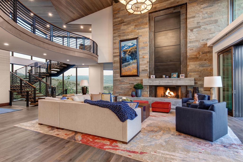 831 N Explorer Peak Drive Home in Heber, Utah. Perched atop the highest ridge within the exclusive confines of Red Ledges, this estate offers unparalleled vistas of the Mountain West. Crafted by renowned architect Michael Upwall, this residence redefines mountain modern living. 