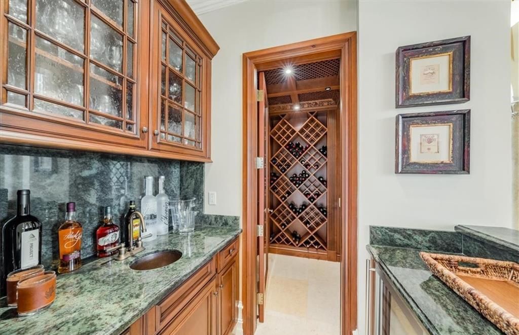 Discover an exquisite 6,500 sq ft single-level home at 2116 Canna Way, Naples, FL, set on a stunning 0.78-acre lot with picturesque lake and golf course views.