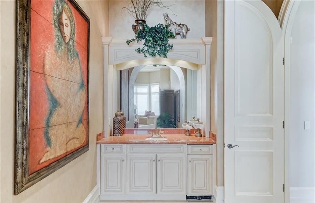 Discover an exquisite 6,500 sq ft single-level home at 2116 Canna Way, Naples, FL, set on a stunning 0.78-acre lot with picturesque lake and golf course views.