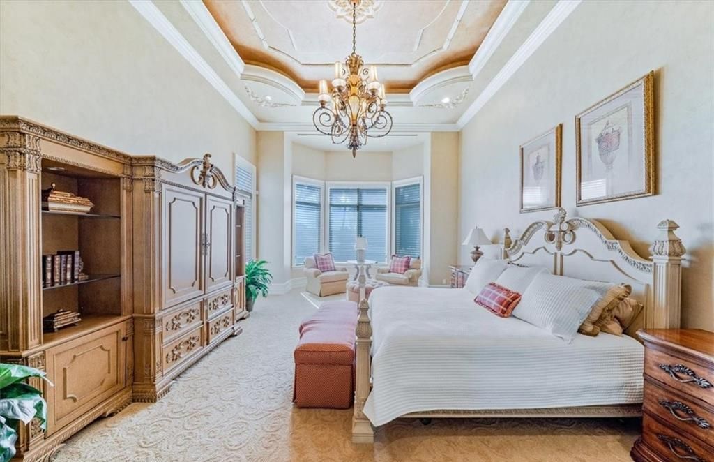 Discover an exquisite 6,500 sq ft single-level home at 2116 Canna Way, Naples, FL, set on a stunning 0.78-acre lot with picturesque lake and golf course views.