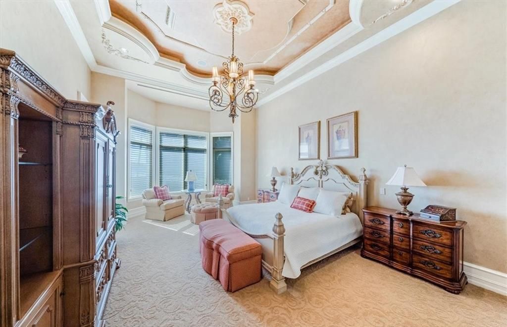 Discover an exquisite 6,500 sq ft single-level home at 2116 Canna Way, Naples, FL, set on a stunning 0.78-acre lot with picturesque lake and golf course views.