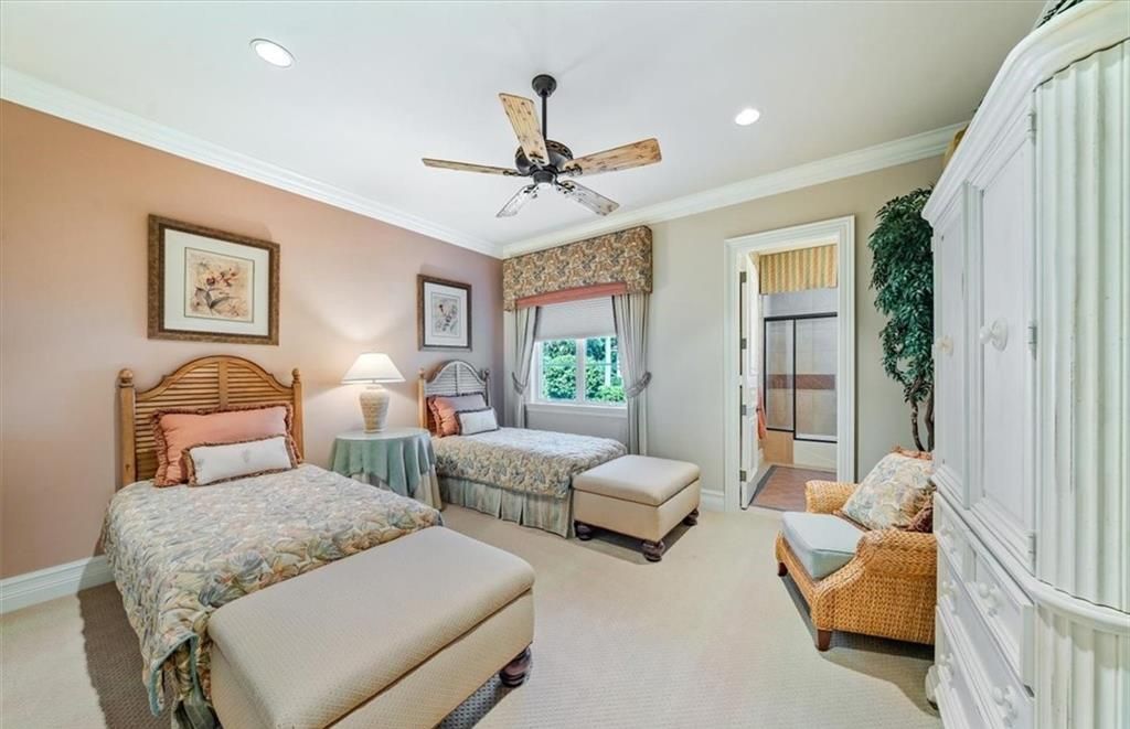 Discover an exquisite 6,500 sq ft single-level home at 2116 Canna Way, Naples, FL, set on a stunning 0.78-acre lot with picturesque lake and golf course views.