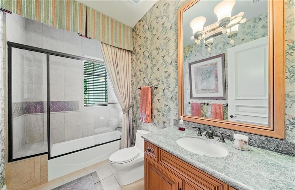 Discover an exquisite 6,500 sq ft single-level home at 2116 Canna Way, Naples, FL, set on a stunning 0.78-acre lot with picturesque lake and golf course views.