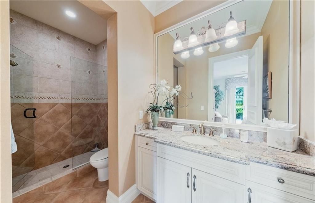 Discover an exquisite 6,500 sq ft single-level home at 2116 Canna Way, Naples, FL, set on a stunning 0.78-acre lot with picturesque lake and golf course views.