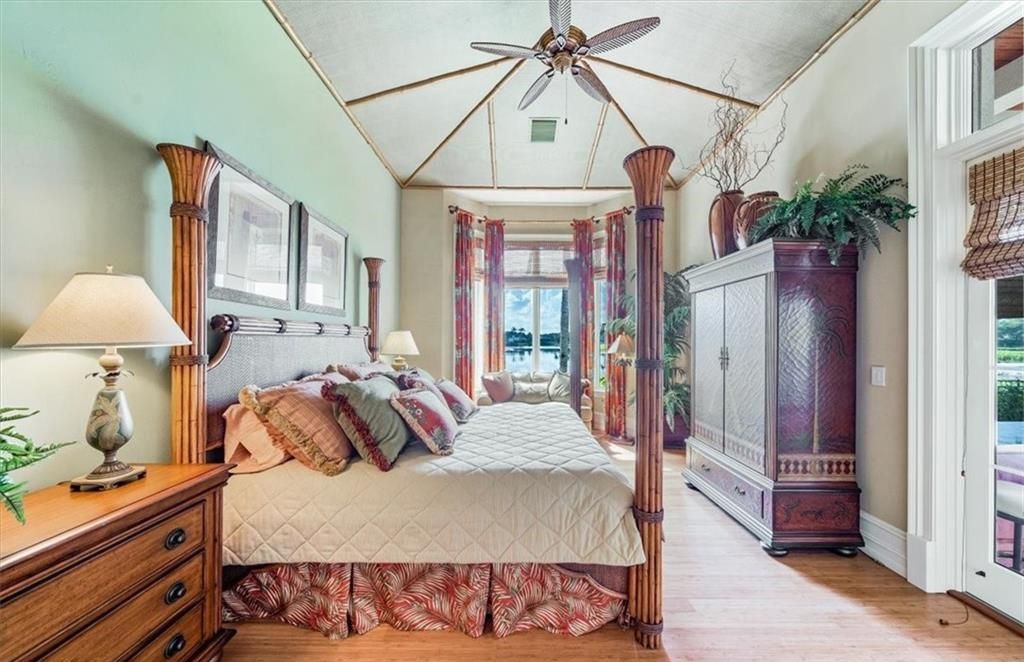 Discover an exquisite 6,500 sq ft single-level home at 2116 Canna Way, Naples, FL, set on a stunning 0.78-acre lot with picturesque lake and golf course views.