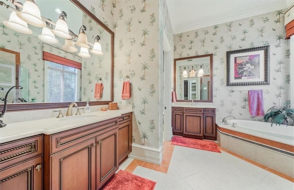 Discover an exquisite 6,500 sq ft single-level home at 2116 Canna Way, Naples, FL, set on a stunning 0.78-acre lot with picturesque lake and golf course views.