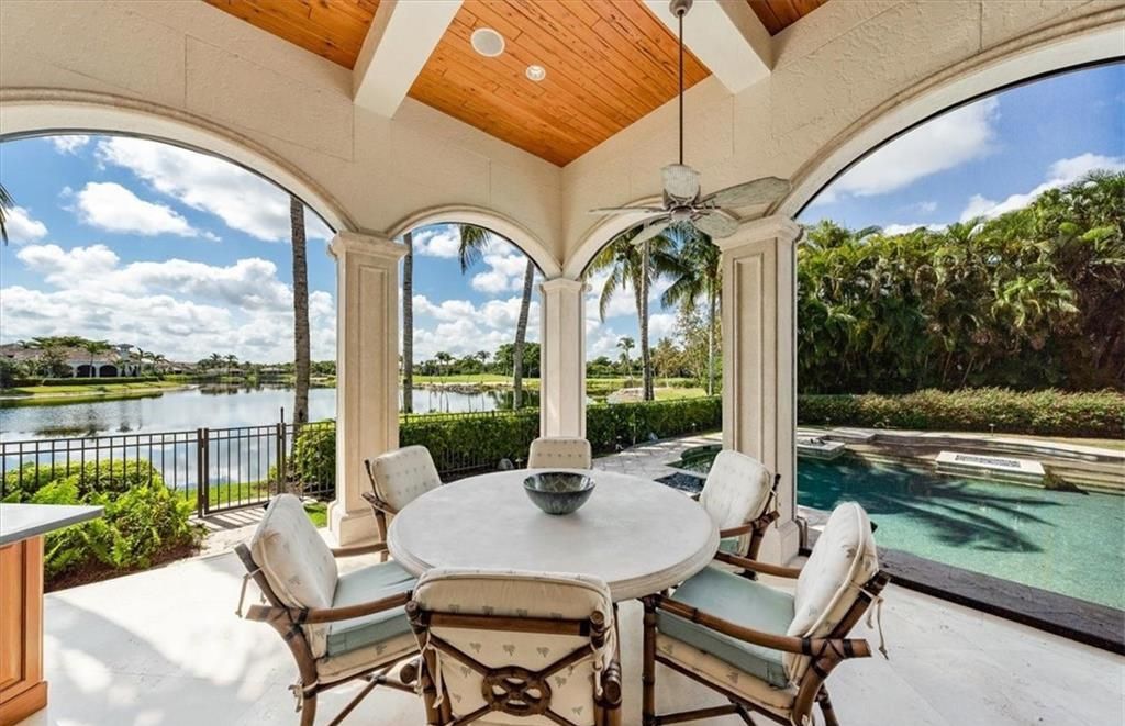 Discover an exquisite 6,500 sq ft single-level home at 2116 Canna Way, Naples, FL, set on a stunning 0.78-acre lot with picturesque lake and golf course views.