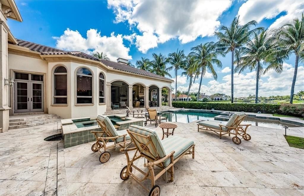 Discover an exquisite 6,500 sq ft single-level home at 2116 Canna Way, Naples, FL, set on a stunning 0.78-acre lot with picturesque lake and golf course views.