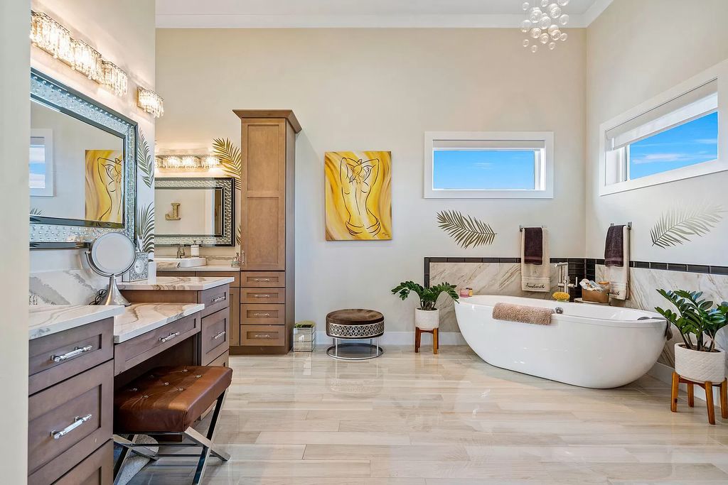 With dual A/C garages and durable coastal design elements throughout, including marine-grade paint and impact glass, this 3-bedroom, 5-bathroom home on a 0.65-acre lot at 3800 Anacostia Pl, Fort Pierce, FL 34949, built in 2019, presents an exceptional opportunity to embrace the coastal lifestyle in utmost comfort and elegance.