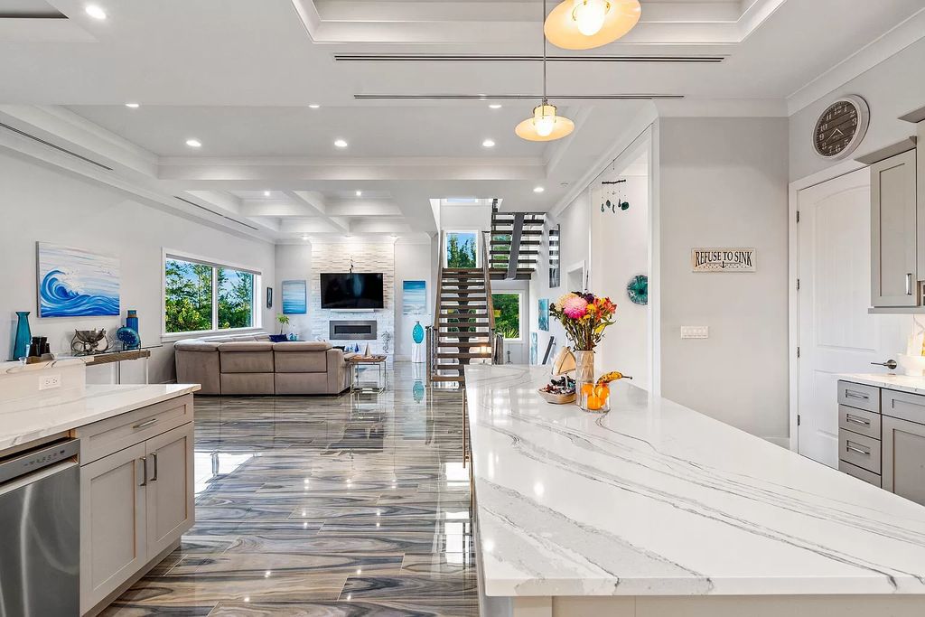 With dual A/C garages and durable coastal design elements throughout, including marine-grade paint and impact glass, this 3-bedroom, 5-bathroom home on a 0.65-acre lot at 3800 Anacostia Pl, Fort Pierce, FL 34949, built in 2019, presents an exceptional opportunity to embrace the coastal lifestyle in utmost comfort and elegance.