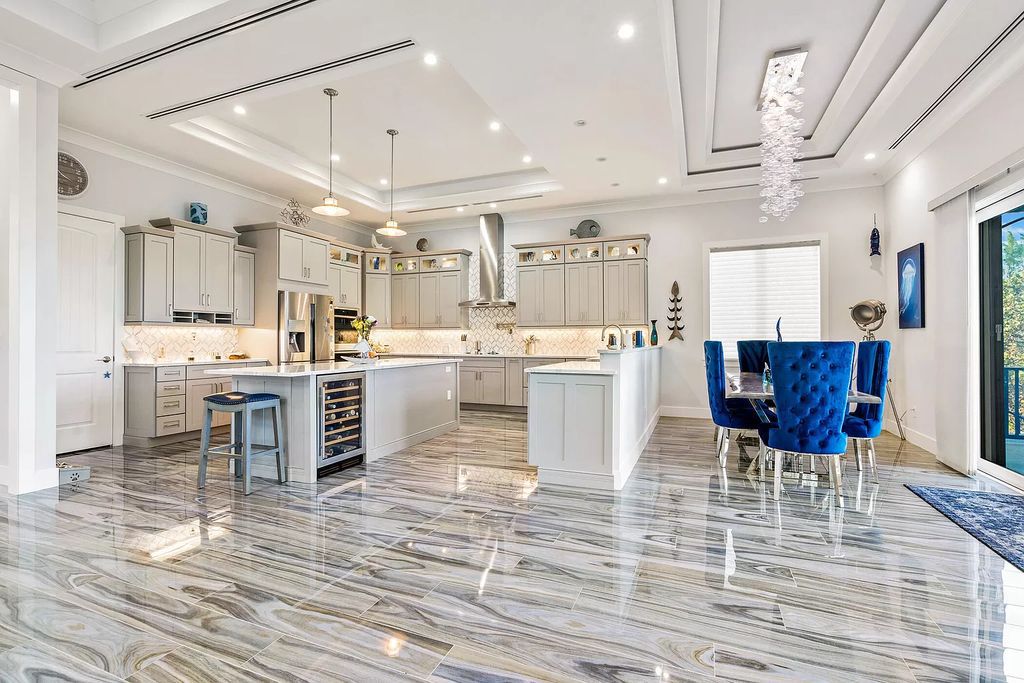 With dual A/C garages and durable coastal design elements throughout, including marine-grade paint and impact glass, this 3-bedroom, 5-bathroom home on a 0.65-acre lot at 3800 Anacostia Pl, Fort Pierce, FL 34949, built in 2019, presents an exceptional opportunity to embrace the coastal lifestyle in utmost comfort and elegance.