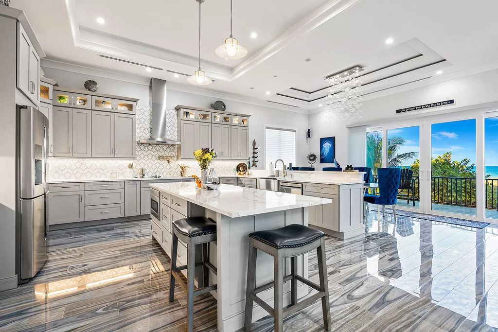 With dual A/C garages and durable coastal design elements throughout, including marine-grade paint and impact glass, this 3-bedroom, 5-bathroom home on a 0.65-acre lot at 3800 Anacostia Pl, Fort Pierce, FL 34949, built in 2019, presents an exceptional opportunity to embrace the coastal lifestyle in utmost comfort and elegance.