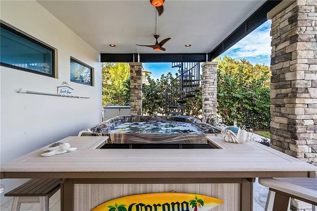 With dual A/C garages and durable coastal design elements throughout, including marine-grade paint and impact glass, this 3-bedroom, 5-bathroom home on a 0.65-acre lot at 3800 Anacostia Pl, Fort Pierce, FL 34949, built in 2019, presents an exceptional opportunity to embrace the coastal lifestyle in utmost comfort and elegance.