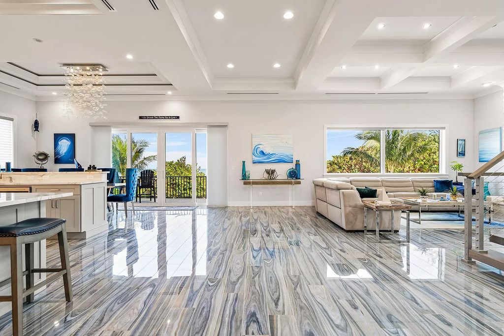 With dual A/C garages and durable coastal design elements throughout, including marine-grade paint and impact glass, this 3-bedroom, 5-bathroom home on a 0.65-acre lot at 3800 Anacostia Pl, Fort Pierce, FL 34949, built in 2019, presents an exceptional opportunity to embrace the coastal lifestyle in utmost comfort and elegance.