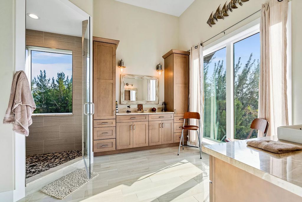 With dual A/C garages and durable coastal design elements throughout, including marine-grade paint and impact glass, this 3-bedroom, 5-bathroom home on a 0.65-acre lot at 3800 Anacostia Pl, Fort Pierce, FL 34949, built in 2019, presents an exceptional opportunity to embrace the coastal lifestyle in utmost comfort and elegance.