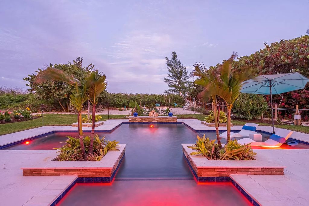 With dual A/C garages and durable coastal design elements throughout, including marine-grade paint and impact glass, this 3-bedroom, 5-bathroom home on a 0.65-acre lot at 3800 Anacostia Pl, Fort Pierce, FL 34949, built in 2019, presents an exceptional opportunity to embrace the coastal lifestyle in utmost comfort and elegance.