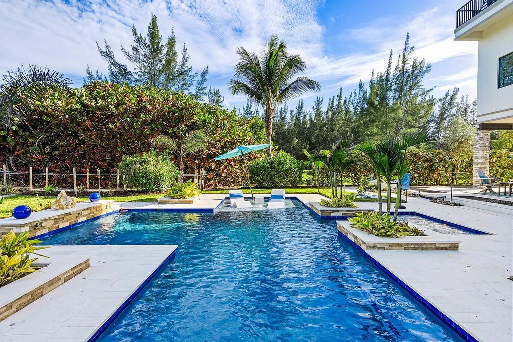 With dual A/C garages and durable coastal design elements throughout, including marine-grade paint and impact glass, this 3-bedroom, 5-bathroom home on a 0.65-acre lot at 3800 Anacostia Pl, Fort Pierce, FL 34949, built in 2019, presents an exceptional opportunity to embrace the coastal lifestyle in utmost comfort and elegance.