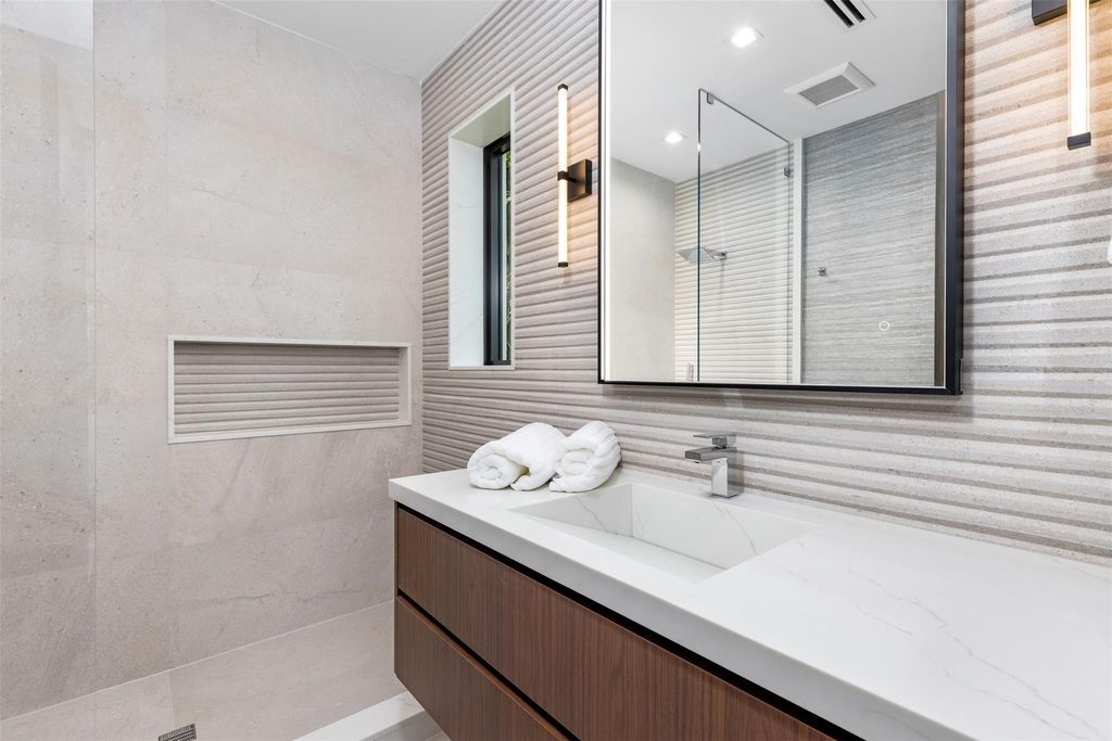 Indulge in unparalleled luxury at 2733 NE 16th St, Fort Lauderdale, FL 33304—an exceptional 5-bedroom, 7-bathroom estate built in 2024 in Coral Ridge.