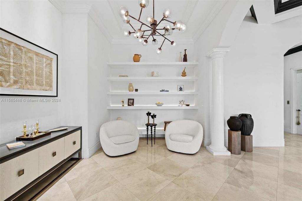 Located in the prestigious gated community of Golden Isles, this exquisite waterfront home at 631 Hibiscus Dr, Hallandale Beach, boasts six bedrooms and seven and a half opulent bathrooms within its 5,829 square feet of refined living space