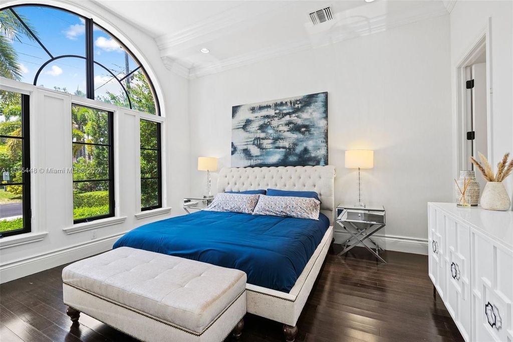 Located in the prestigious gated community of Golden Isles, this exquisite waterfront home at 631 Hibiscus Dr, Hallandale Beach, boasts six bedrooms and seven and a half opulent bathrooms within its 5,829 square feet of refined living space