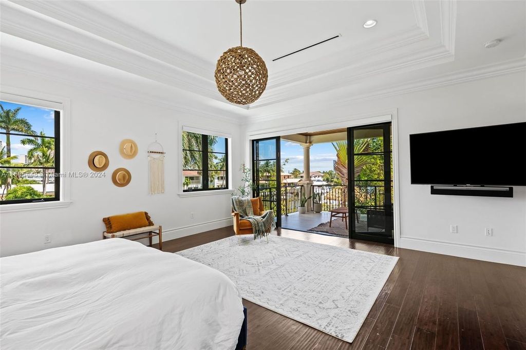 Located in the prestigious gated community of Golden Isles, this exquisite waterfront home at 631 Hibiscus Dr, Hallandale Beach, boasts six bedrooms and seven and a half opulent bathrooms within its 5,829 square feet of refined living space